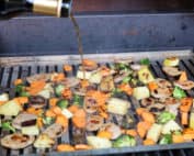 TEC Grills One Grill Pan Suppers - Pouring Balsamic Vinegar over the Food on the Grill